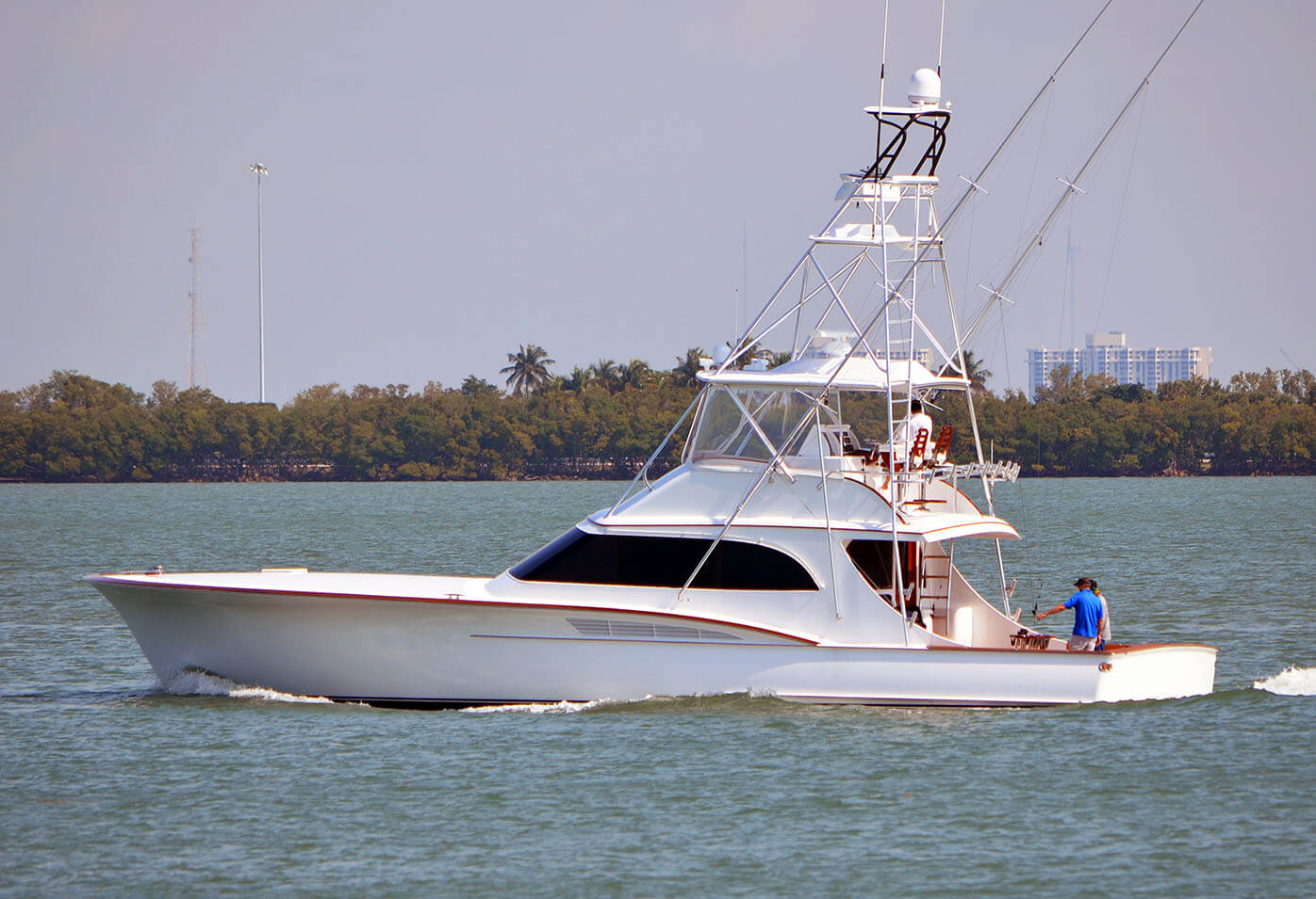 Sport fishing boat cruising slowly on the Florida Intra-Coastal Waterway off Miami Beach